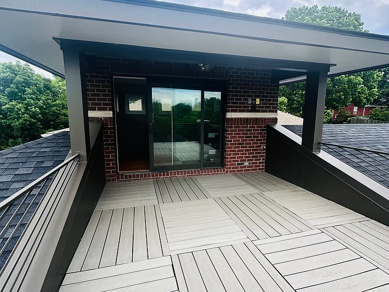 Welcome to the rooftop deck! This huge deck also has a covered outdoor sitting area as well as an inside wet bar and sitting area. A Sonos surround system is inside and out for all of your entertainment needs!