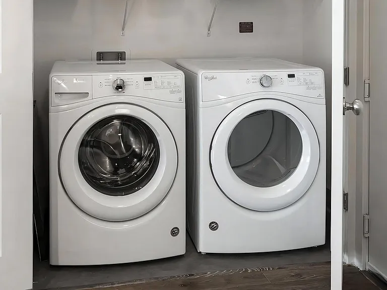 Side-by-Side Front-Loading Laundry Machines in Apartment Unit