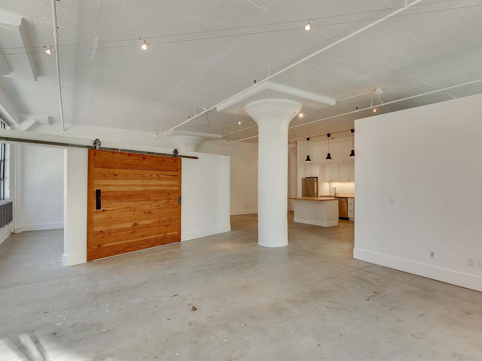 Main living area looking back towards kitchen and entry