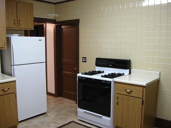 Refrigerator and oven range included.