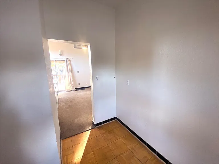 Small office or dressing room entrance to a main upstairs room