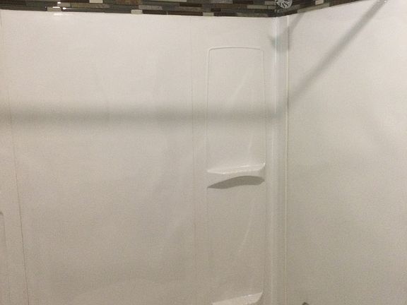 Updated shower wall and tub