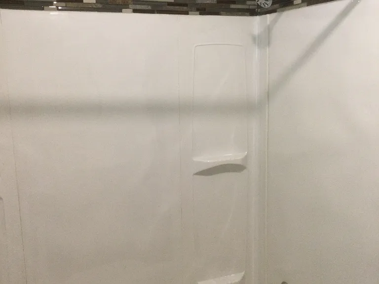 Updated shower wall and tub