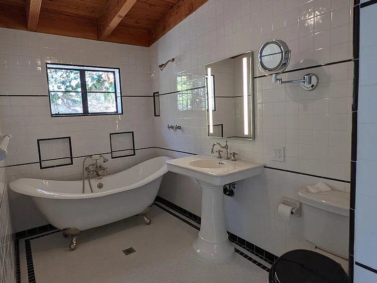 72" Double Slipper Cast Iron Tub + Shower and Medicine Cabinet.