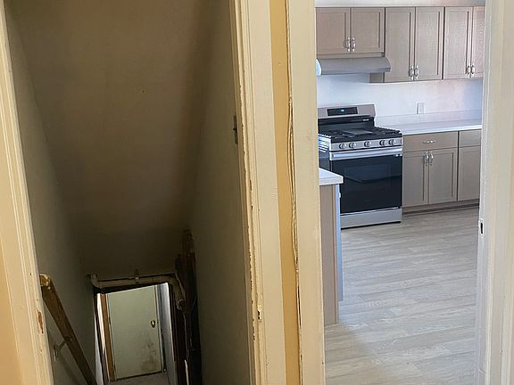 View towards Kitchen and Rear stairs to backyard