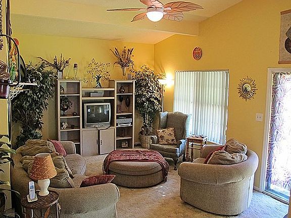 Spacious living room with vaulted ceiling.