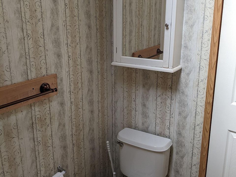 Toilet with storage above.