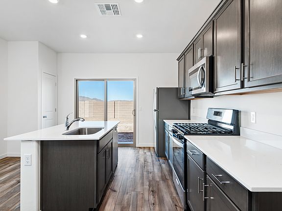 The kitchen comes with a full suite of stainless steel appliances!