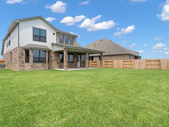 Come and see this spacious backyard with its beautiful covered patio. There is plenty of room for a