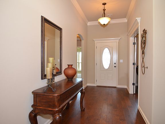 High ceiling in entry with wood floor