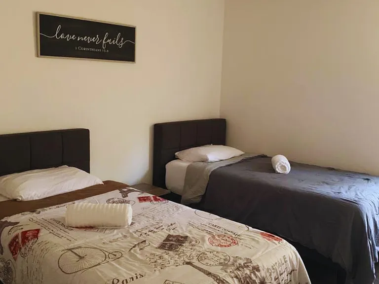 Bright Bedroom with a Spacious Closet & Stylish Decor.