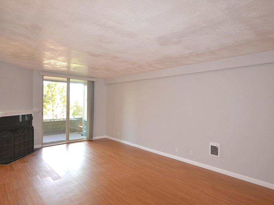 Living Room with fireplace and sliding door accessing the balcony