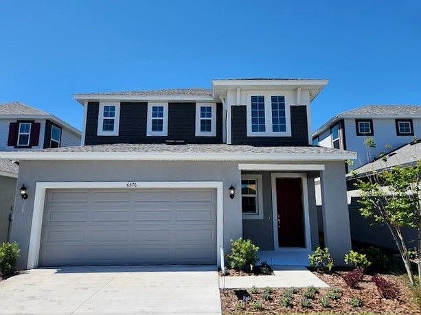 Sandhill new home plan exterior coastal elevation at BridgeWater at William Ryan Homes Tampa