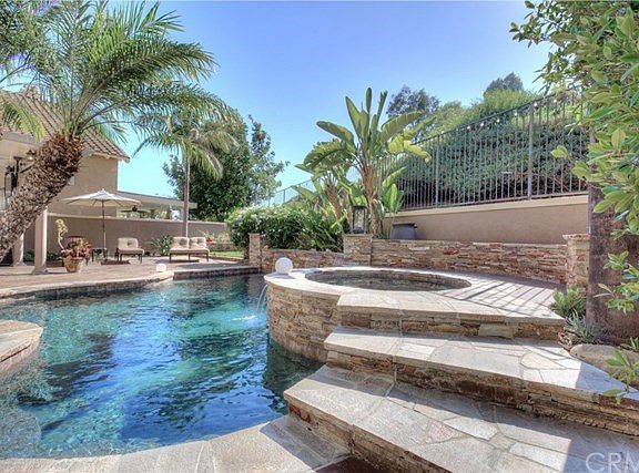 Recently redone Pool, Spa, and deck are fabulous. The custom hardscape and softscape make this a backyard oasis sure to impress.
