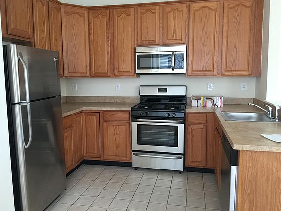 Kitchen with all stainless steel appliances and 42" cabinets