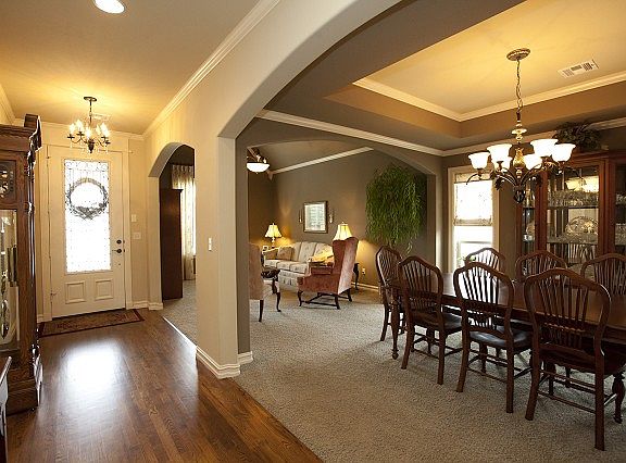 Warm Entry with Hardwoods and Archways
