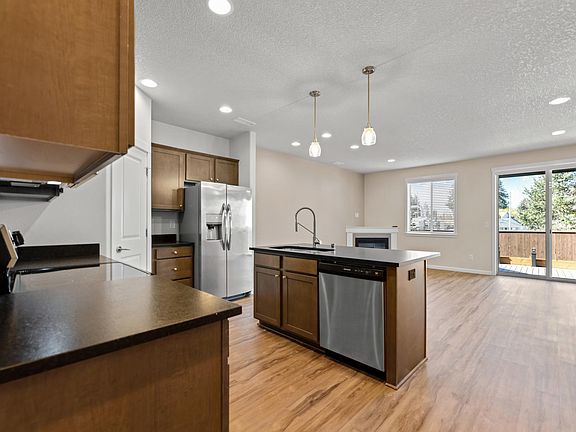 Kitchen & Living Room as you walk in from the garage