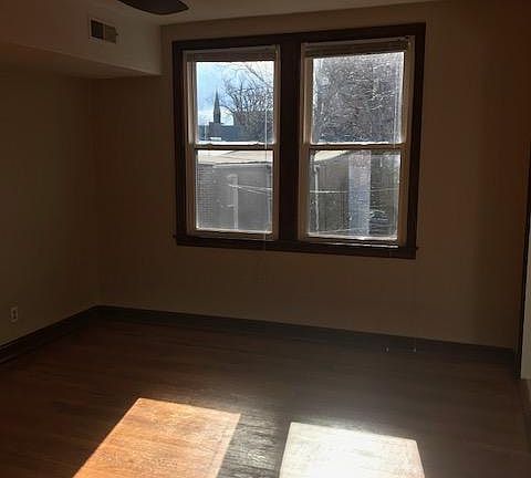 Living Room-on a sunny morning. The apartment faces South and full of natural light.