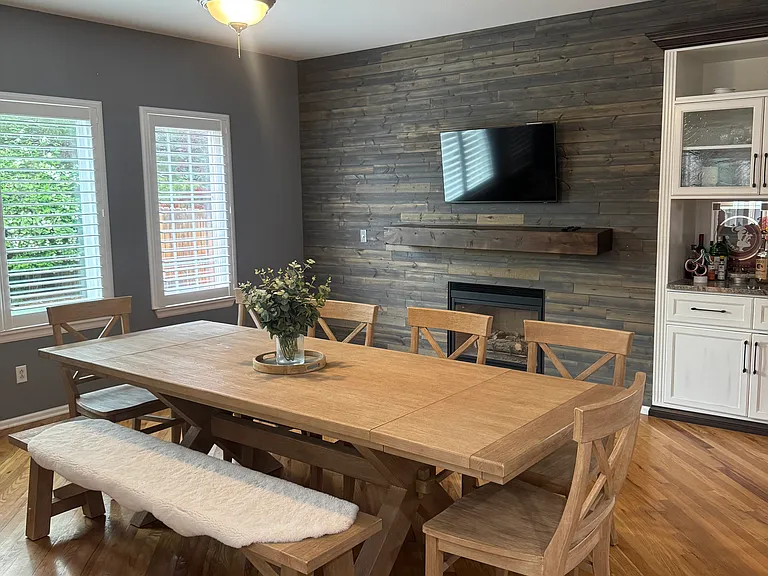 Custom built-in liquor cabinet and media control center. Large TV mount included.