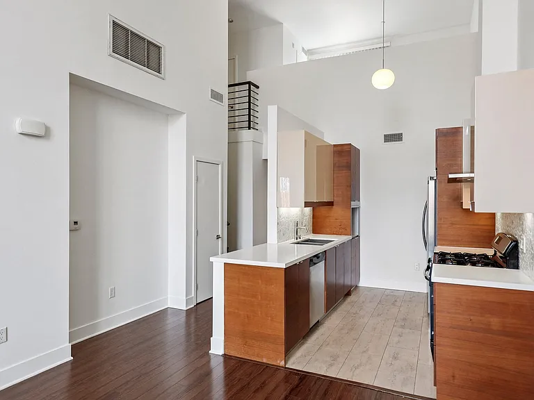 Open-Concept Floor Plans with High Ceilings and Vinyl Flooring
