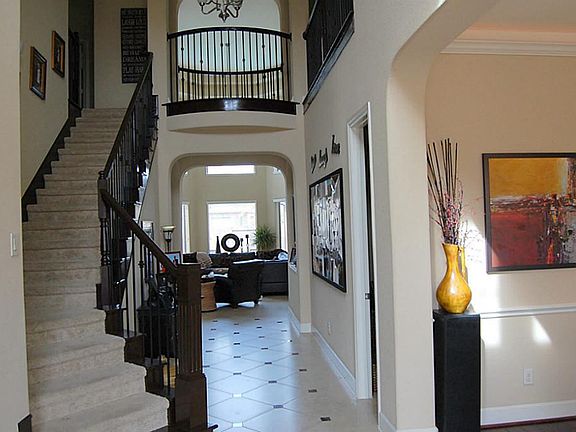 TWO STORY ENTRY WROUGHT IRON SPINDLES