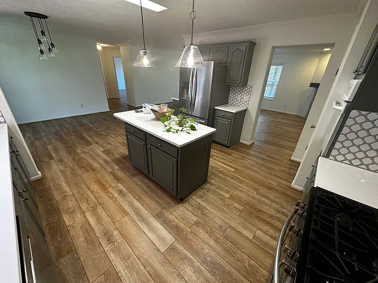 View from the corner of the kitchen by the dishwasher.
Double door refrigerator, bottom drawer freezer. Ice and water options for the fridge.