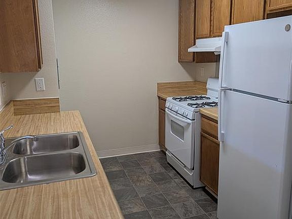 The well-appointed kitchen comes with ample cabinets, sleek countertops, and modern appliances- ideal for home cooks, and take out lovers alike.