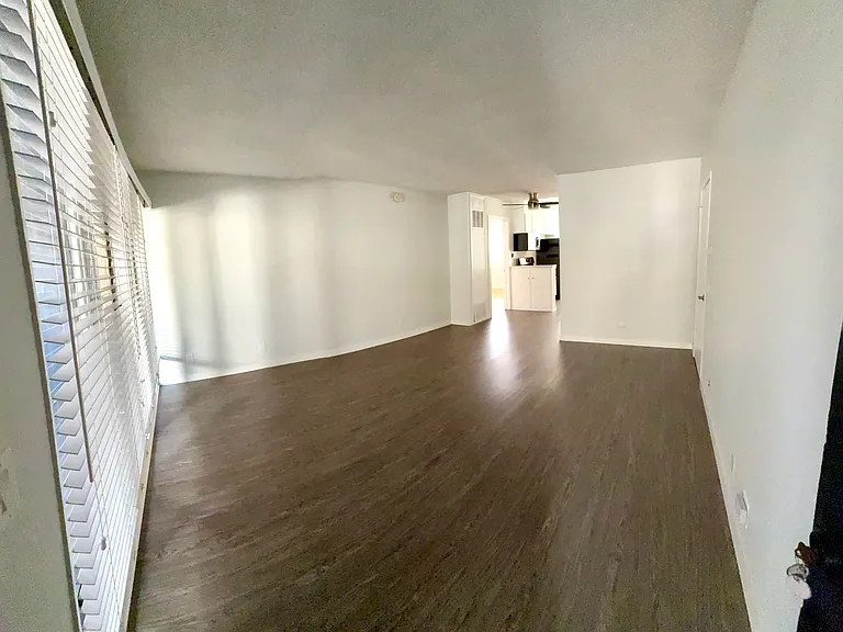 View of the living room and dining room from the front door.