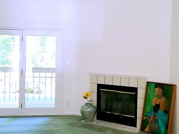 Spacious Living Area with Vaulted Ceilings and Rear Deck