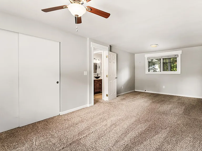Upper level Primary Bedroom. Currently with updated LVP Flooring.