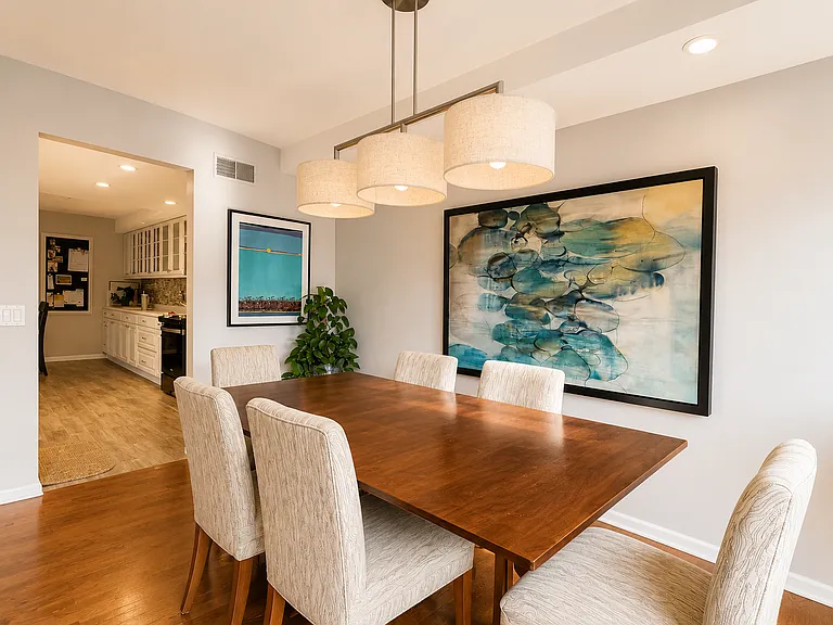 Open concept living dining floor plan with patio walkout. Dining table extends to comfortably seat 8