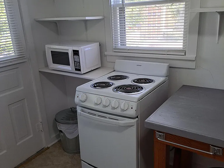 Apartment size stove, and more storage shelves.