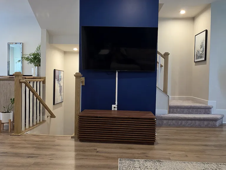 Living room; view facing the stairway leading to the lower rec room and upper bedrooms.