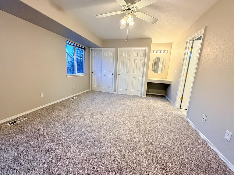 Upstairs primary bedroom view from entryway.