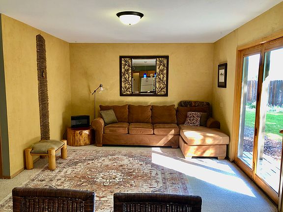 One of two living rooms. This is attached to the kitchen and opens into the back yard.