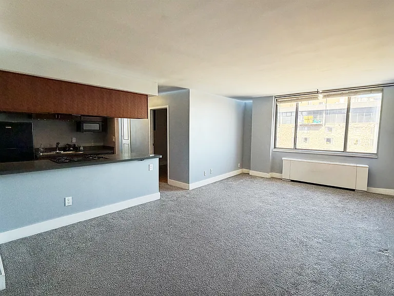Living Room
Open-concept living and dining area with kitchen views _ perfect for entertaining