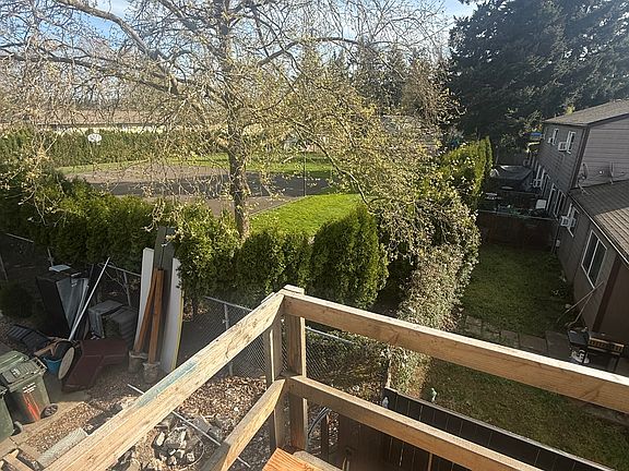 This is the landing on top of the stairs. The decking will be a black/grey trex. The railing will be welded in place black iro Notice the black eaves which cover the stairs and landing. The landing is a nice place to enjoy an AM coffee...very serene.