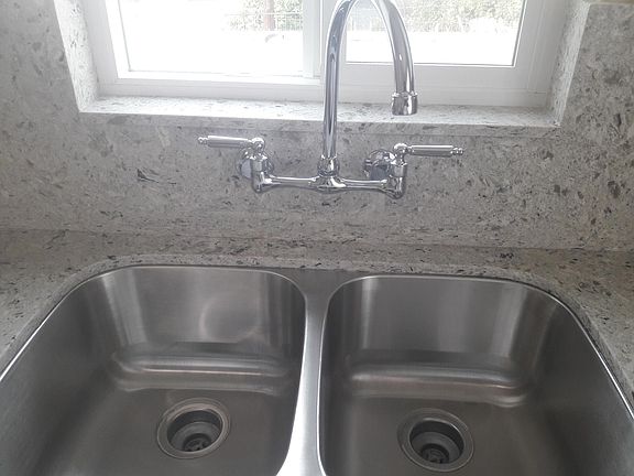 New Quarts countertops, sink and windows.