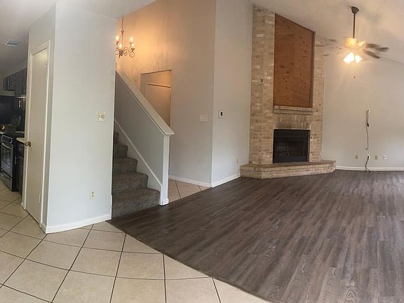 View from dining room. Kitchen on left, living room on right.