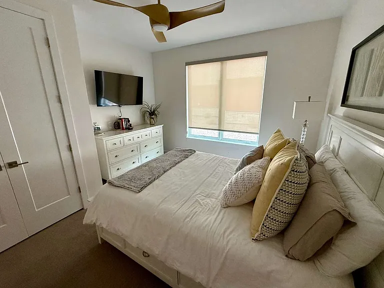Bedroom 3 with queen bed, closet and smart tv