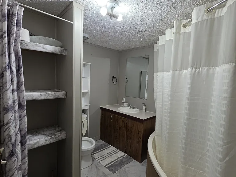Large bathroom with plenty of storage.