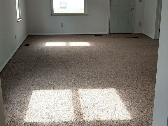 large living room with lots of windows