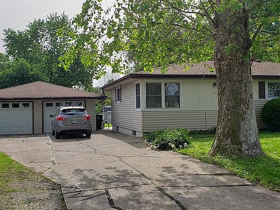 Driveway & oversized garage.