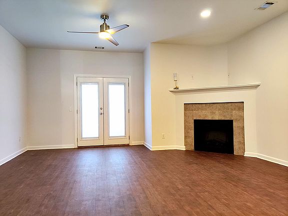 LIVING/DINING AREA W/ FIREPLACE