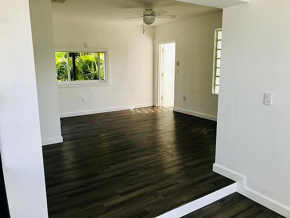 Living space with a view of the front door (open)