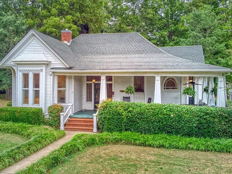 Front view of home with wrap-around porch