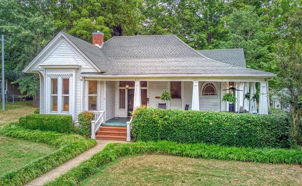 Front view of home with wrap-around porch