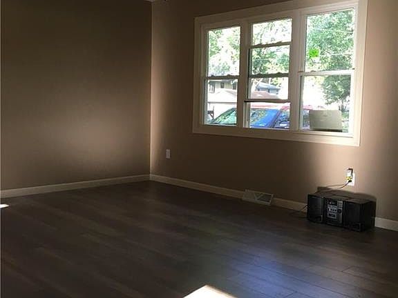 Living Room with new flooring, windows, light fixtures, sheet rock & paint