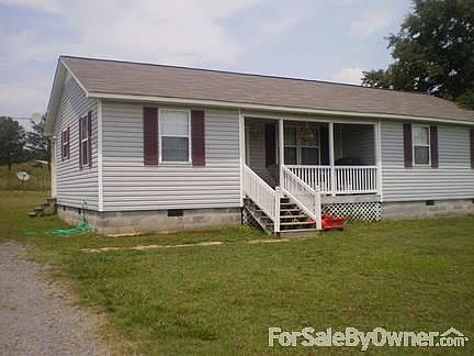 Gravel driveway with small shed for storage