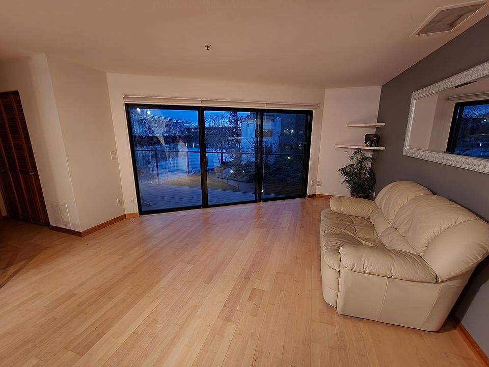 Living room with river view, slider to main deck.